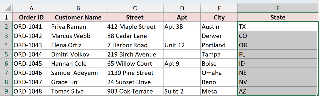 The state codes in column F selected before running Fill Justify